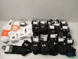 several pairs of black and white socks are on a table