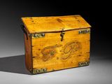 an old wooden box with a chain on the inside