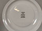 a white plate with a black and white design on it