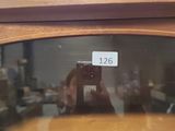 a person taking a picture of a shelf with a camera