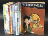 un grand nombre de livres posés sur une table