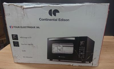 packaging of a boxed oven sitting on top of a wooden table