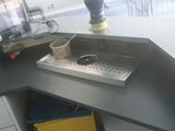 an image of a kitchen with a sink and a computer