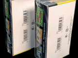 two boxes of nintendo wii games on a black background