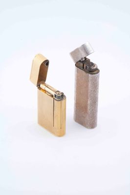 two lighters sitting next to each other on a white surface