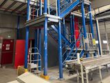 a picture of a large industrial building with a staircase going up