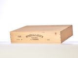 a wooden box with a label on it sitting on a table