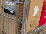 a cart full of boxes sitting on the floor of a store