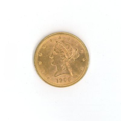 une image d'une pièce d'or sur une surface blanche