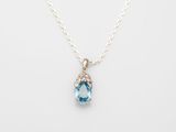 a blue topaz quartz and diamond pendant on a silver chain