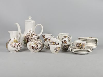 many different types of coffee pots and cups on the table