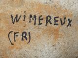 a rock with writing on it that says wi merreux gr