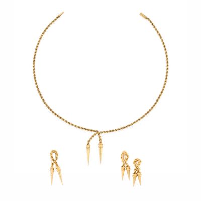 a close up of a necklace and earrings on a white background