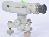 a close up of a camera on a tripod on a white background