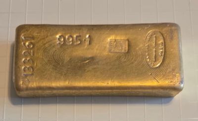 a gold bar sitting on top of a white counter top