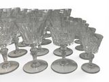 a lot of wine glasses that are sitting on the table
