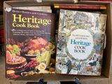 two books in a box that are sitting on a table