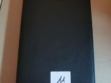 a black leather case with a white sticker on it