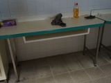 a sink and a counter in a small room