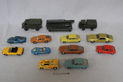 a lot of toy cars and a train on a table
