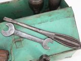 two wrenches in a tool box with a hammer in it