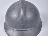 a helmet on a white surface with a white background