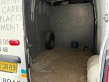 a white van with the door open in a garage