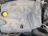 a dirty car engine with its hood open