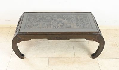 a coffee table with a glass top on a tiled floor