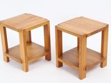 two small wooden tables sitting side by side