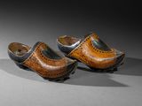 pair of clogs in the shape of a shoe