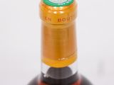 a bottle of wine that is sitting on a table