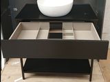 a white bowl sitting on top of a black table