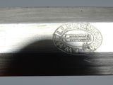 a close up of a knife with a metal handle