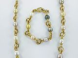 a necklace and bracelet set with multi colored pearls