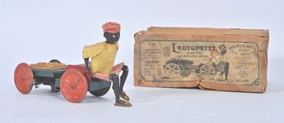 toy figurine of a man sitting on a tractor next to a box of money