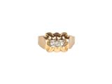 a close up of a gold ring with three diamonds on it