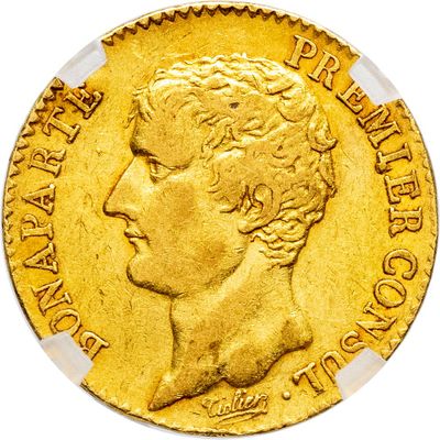 gros plan d'une pièce d'or portant un visage de femme