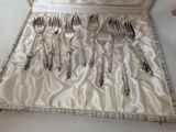 a case with silverware inside of it on a table