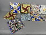a lot of different colored tiles sitting on a table