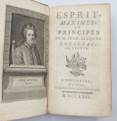 un vieux livre sur lequel figure l'image d'un homme assis sur une chaise