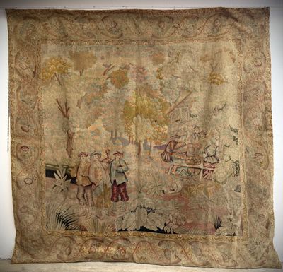 an old tapestry hanging on a wall in a room