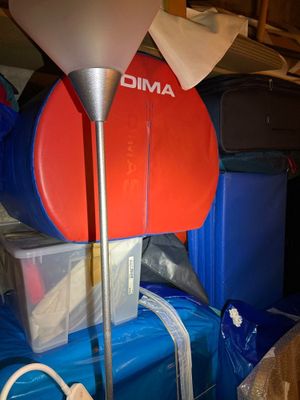 a lamp that is on top of a pile of luggage