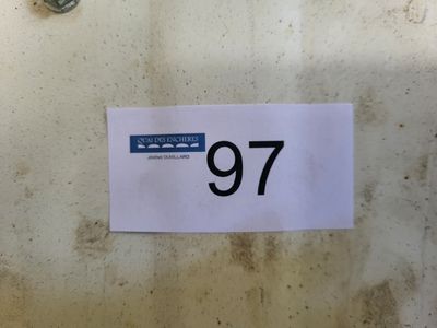 une photo d'une feuille de papier sur laquelle figure le chiffre 97