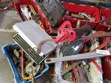 a pile of assorted tools and tools in a garage