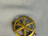 an image of a gold broochle with a cross and a cross on it