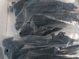 a bunch of black hair clips in a plastic bag
