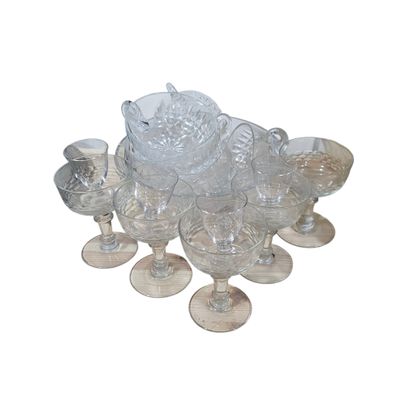 a lot of glasses that are sitting on a table