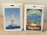 two cards on a table with a picture of a lighthouse