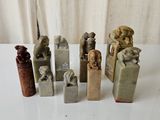 many different types of stone sculptures on a table